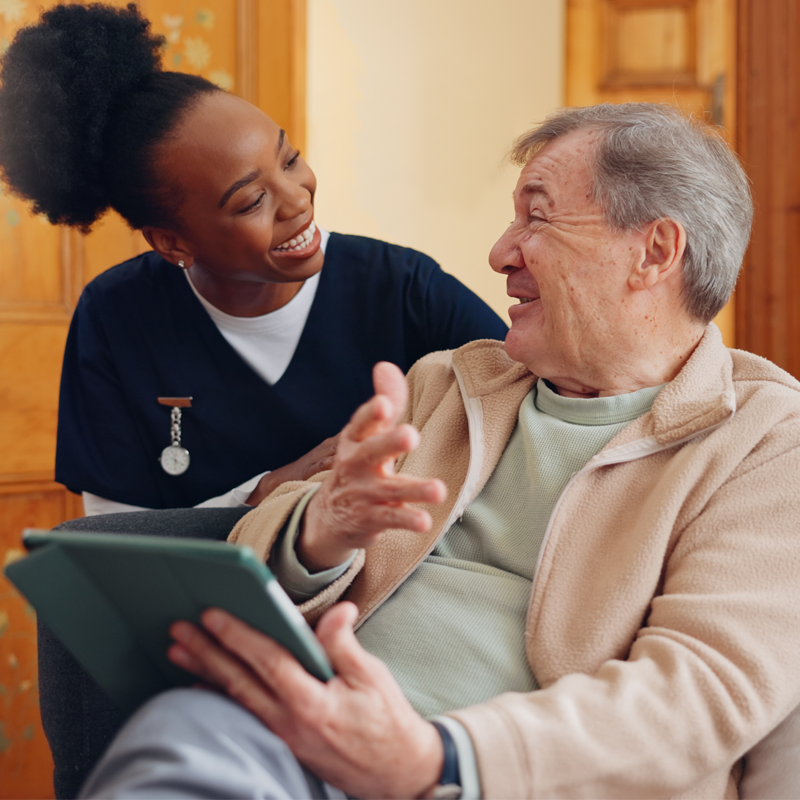 Caregiver holding senior's hand